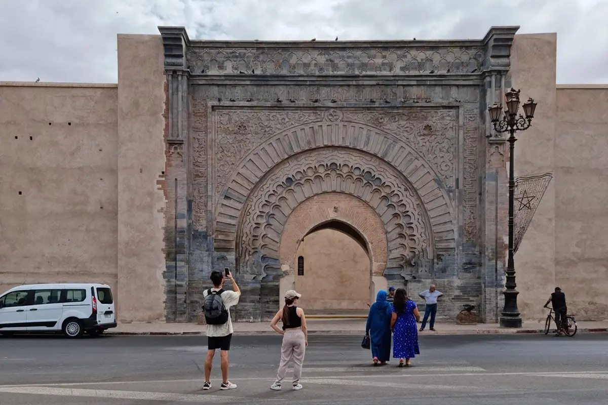 Travelers visiting Bab Agnaou in Marrakech before a 3-day desert tour to Merzouga