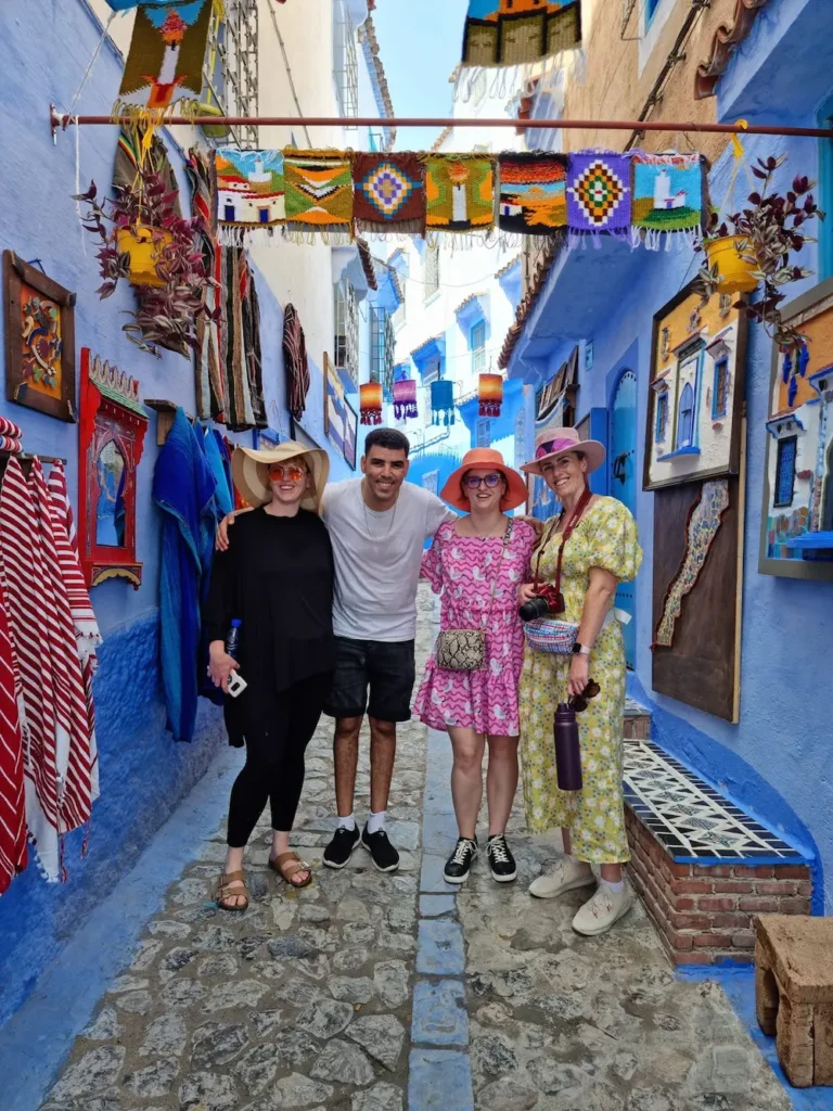 Aziz Azoulay with clients exploring Chefchaouen during a Morocco tour
