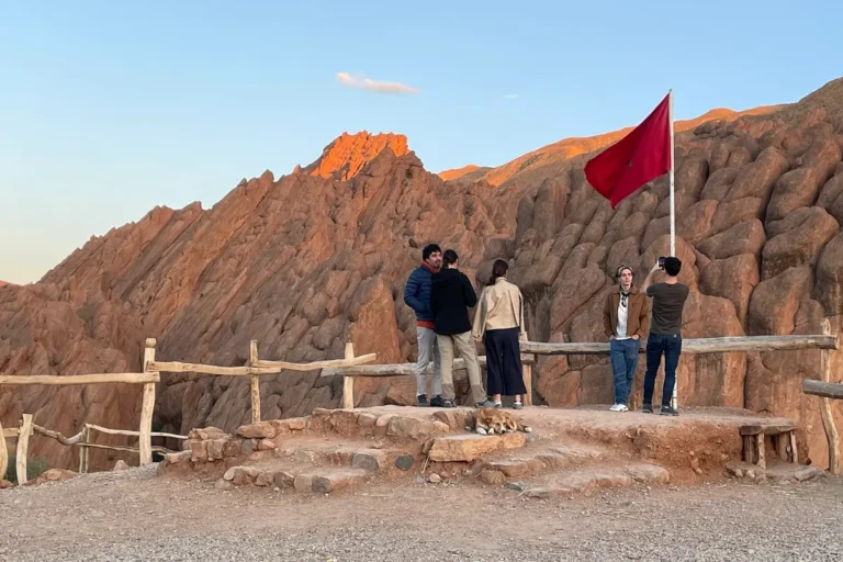 Travelers admiring the rock formations in Dades Valley, Morocco