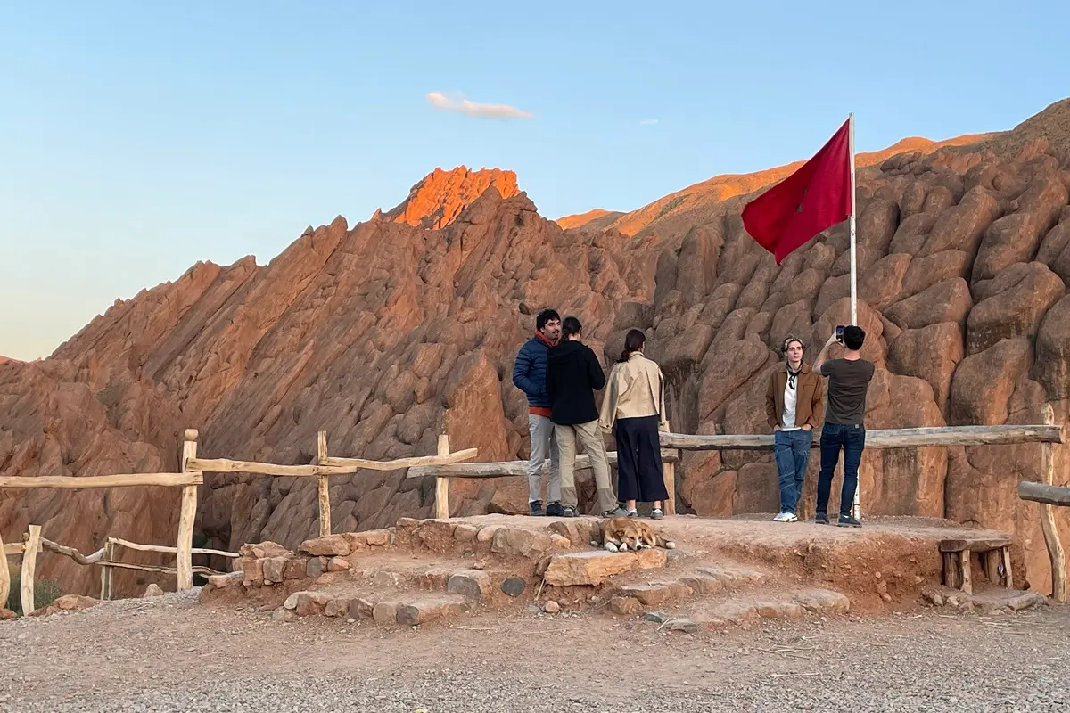 Travelers admiring the rock formations in Dades Valley, Morocco